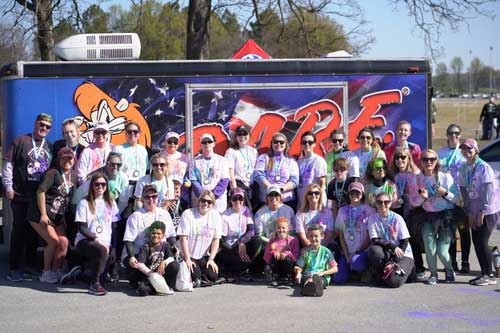 CRG Family in front of D.A.R.E. trailer